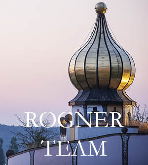 Eine goldene Zwiebelkuppel im Abendlicht mit dem Text „Rogner Team“. Ein Klick auf das Bild führt zur Landingpage „Rogner Team“